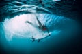 Surfer woman with surfboard dive underwater with under big ocean wave. Royalty Free Stock Photo