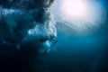 Surfer woman with surfboard dive underwater with under sea wave Royalty Free Stock Photo