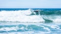 Surfer woman with surfboard is paddling on the wave Royalty Free Stock Photo