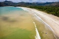 Surfers on the beach and in the ocean at Selong Belanak, Lombok, Indonesia