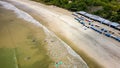 Surfers on the beach and in the ocean at Selong Belanak, Lombok, Indonesia