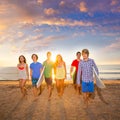 Surfers boys and girls group walking on beach Royalty Free Stock Photo