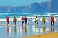 Surfers getting surfing lessons at Praia Vale Figueiras in Portugal