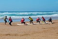 Surfers getting surfing lessons at Praia Vale Figueiras in Portugal