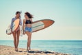 Surfers girls on beach having fun in summer Vacation. Extreme Sp Royalty Free Stock Photo