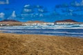 Surfers and kiters in the water on Famara beach