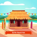 Surfers lagoon beach hut with standing surfboards