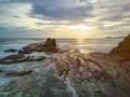 Surfers in magnific rock bay Royalty Free Stock Photo