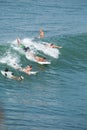 Surfers near Pura Tanah Lot Bali, Indonesia Royalty Free Stock Photo