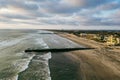 Surfers in ocean by jetty in Imperial Beach San Diego California, aerial shot. Royalty Free Stock Photo