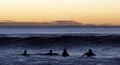 Surfers Paddling Out