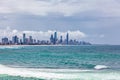 Surfers Paradise skyline over ocean waves. Royalty Free Stock Photo