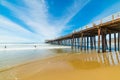 Surfers by Pismo Beach pier Royalty Free Stock Photo