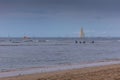 Surfers and sail boat on ocean off beach, Lahaina, Maui, Hawaii, USA Royalty Free Stock Photo