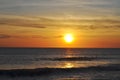 Surfers at sunset