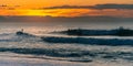 Surfers at sunset in Biarritz, France Royalty Free Stock Photo
