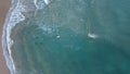 Surfers in the surf waiting for waves in the turquoise ocean off the Victorian Coastline Royalty Free Stock Photo