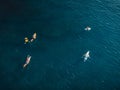 Surfers with surfboards in blue ocean waiting wave. Aerial view Royalty Free Stock Photo