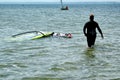 Surfers swimming on boards on the Puck Bay in poland on a warm summer day