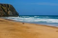 Surfers on the Ursa beach, Portugal - westernmost point of mainland Europe