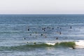 Surfers waiting for the next wave at the Malibu beach, California in summer time