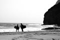 Surfers walking on the beach