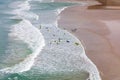 Surfers in the waves off Mawgan Porth Beach, UK Royalty Free Stock Photo