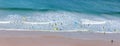 Surfers in the waves off Mawgan Porth Beach, UK Royalty Free Stock Photo