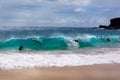 Surfers in the waves at Sandy Beach Hawaii Royalty Free Stock Photo