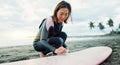 Surfing, beach and woman waxing surfboard for water sports, fitness and freedom by ocean. Nature, travel and happy Royalty Free Stock Photo