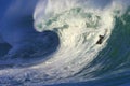 Surfing a Big Wave at Waimea Bay in Hawaii Royalty Free Stock Photo
