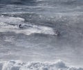 Surfing Big Waves in North Beach, Nazare. Royalty Free Stock Photo