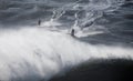 Surfing Big Waves in North Beach, Nazare. Royalty Free Stock Photo