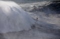 Surfing Big Waves in North Beach, Nazare. Royalty Free Stock Photo