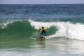 Surfing boy at Arpoador beach in Rio de Janeiro