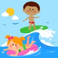 Children surfing on a wave in the sea.