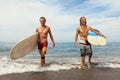 Surfing. Cheerful Young Surfers With Surfboards. Handsome Men Walking On Ocean Beach. Royalty Free Stock Photo