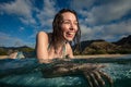 Surfing girl having fun in water Royalty Free Stock Photo