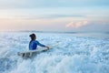 Surfing Girl. Surfer With Surfboard Swimming In Ocean. Brunette In Blue Wetsuit Going To Surf In Splashing Sea.