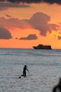 Surfing during the Hawaiian sunset Royalty Free Stock Photo