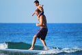 Father with son surfing