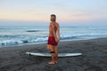 Surfing Man. Stretching Surfer On Sandy Beach Going To Surf On Surfboard In Beautiful Tropical Ocean. Royalty Free Stock Photo