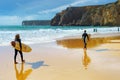 Surfing men surfboard Algarve Portugal Royalty Free Stock Photo