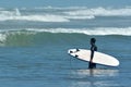 Surfing in Muriwai beach - New Zealand