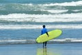 Surfing in Muriwai beach - New Zealand