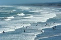Surfing in Muriwai beach - New Zealand
