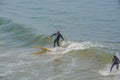 Surfing on the Pacific Ocean at Pismo State Beach in San Luis obispo County, California