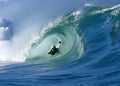 Surfing a Perfect Tube Wave at Waimea Bay Hawaii Royalty Free Stock Photo