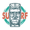 Surfing print of stone tiki mask, face idol