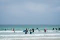 Surfing school students in a sea